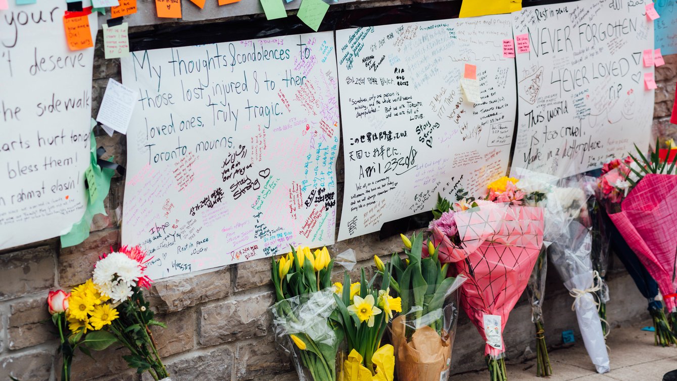 Flowers and messages are placed at a memorial for victims of the mass killing on April 24, 2018 in Toronto, Canada.