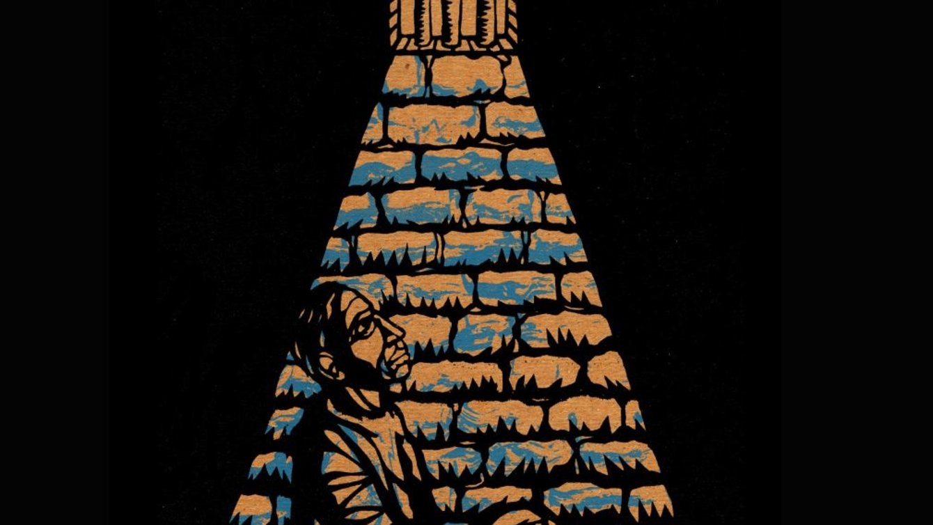 A man sits incarcerated.