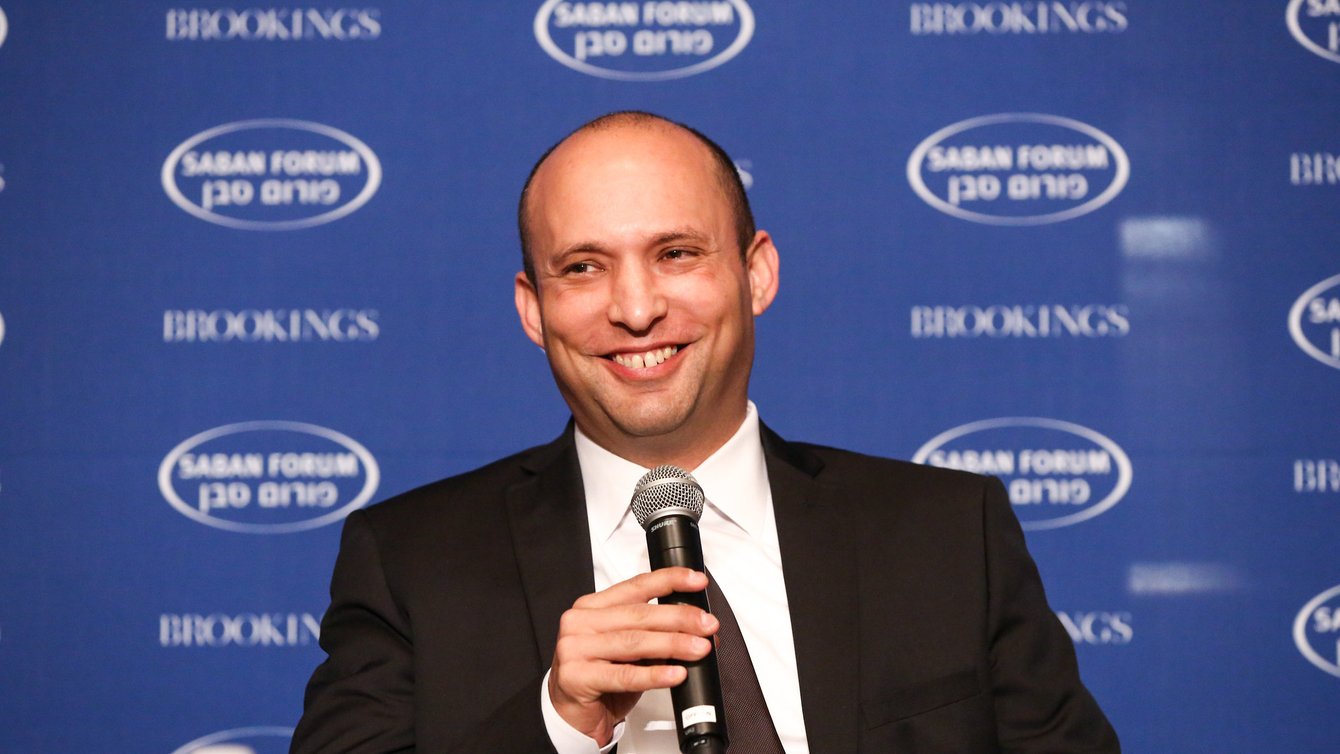 Man holding microphone and smiling