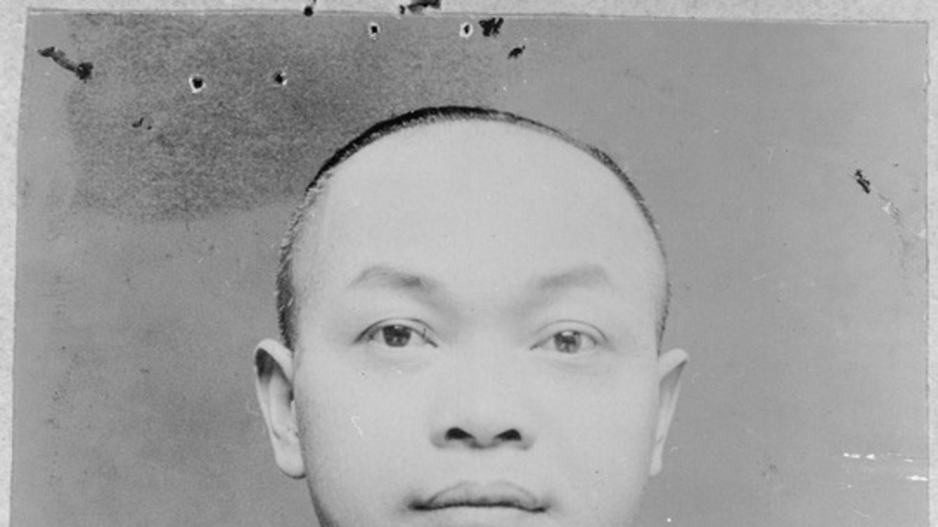 a black and white image of a man.