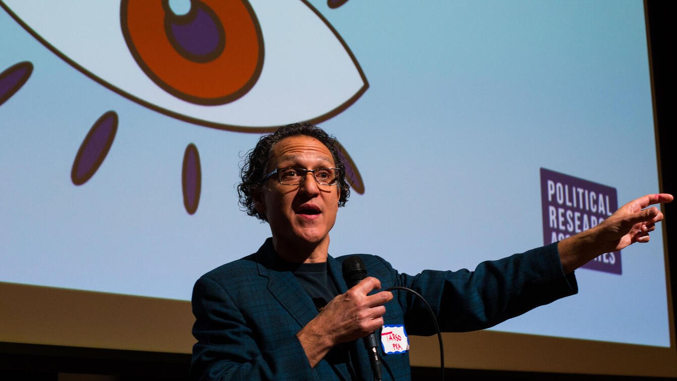 Tarso Luis Ramos speaks from stage