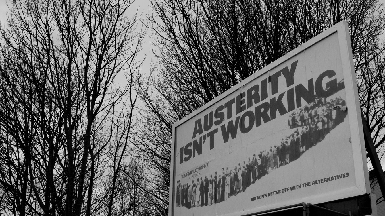 a banner that reads "Austerity isn't working"