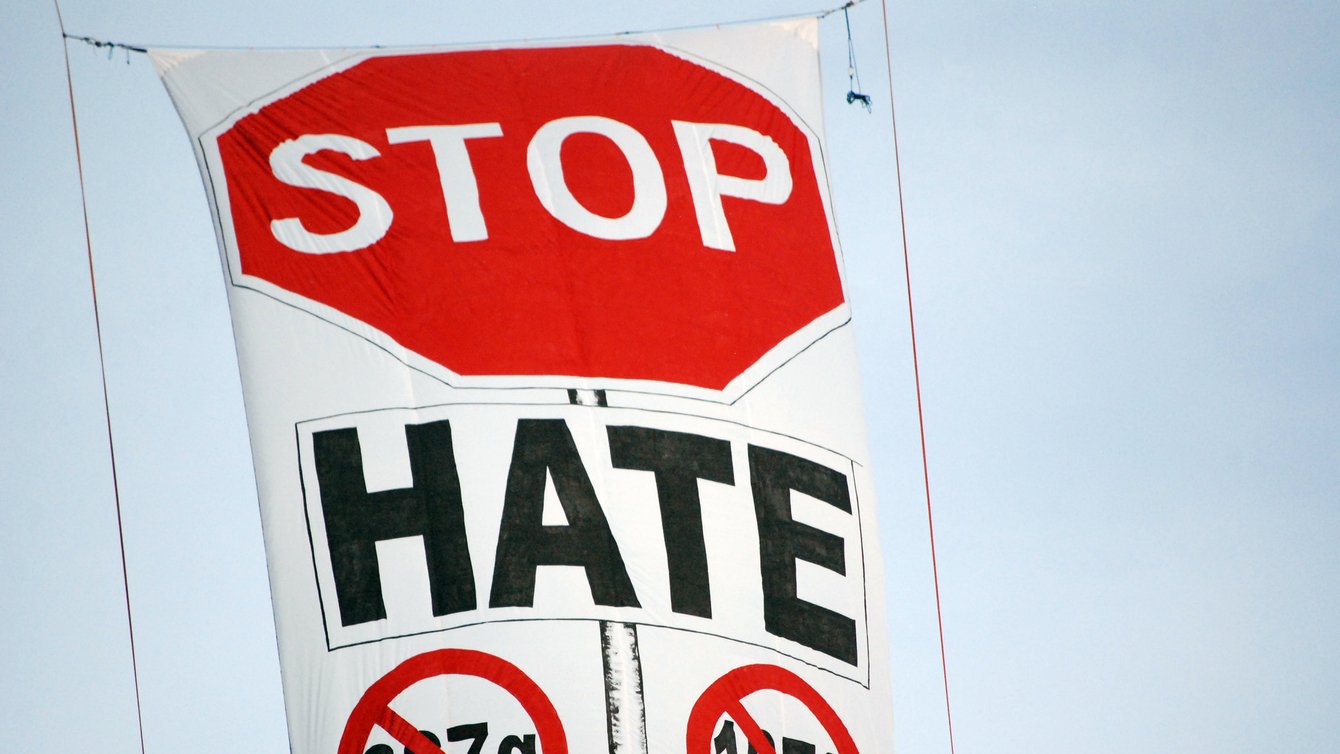 A banner that reads "Stop Hate" and crosses out 287g and 1070
