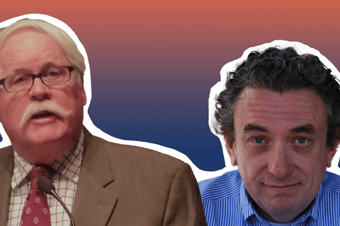 A White man with white hair in a grey suit and a man in a blue shirt.