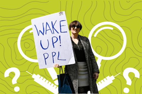 a person holding a sign saying "wake up ppl"