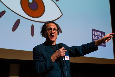 Tarso Luis Ramos speaks from stage