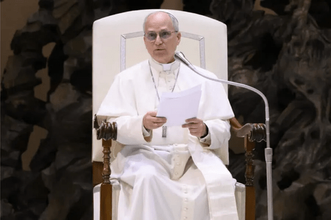 a man in white robes sitting in a white chair