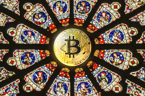a stained glass type mandala with bitcoin symbol in the middle