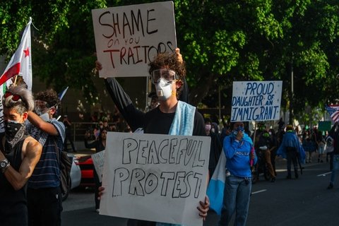 protestors holding signs