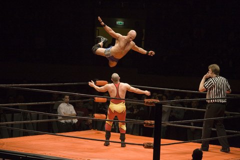 Christopher Daniels performing a flying crossbody on Jonny Storm