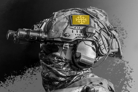 yellow highlight of jerusalem cross on US soldier’s helmet